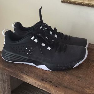 Black and white Under Armour shoes